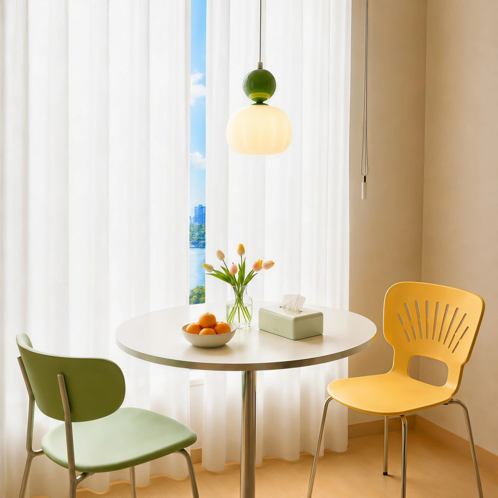 Green debz macaron pendant light illuminating a vibrant modern dining space