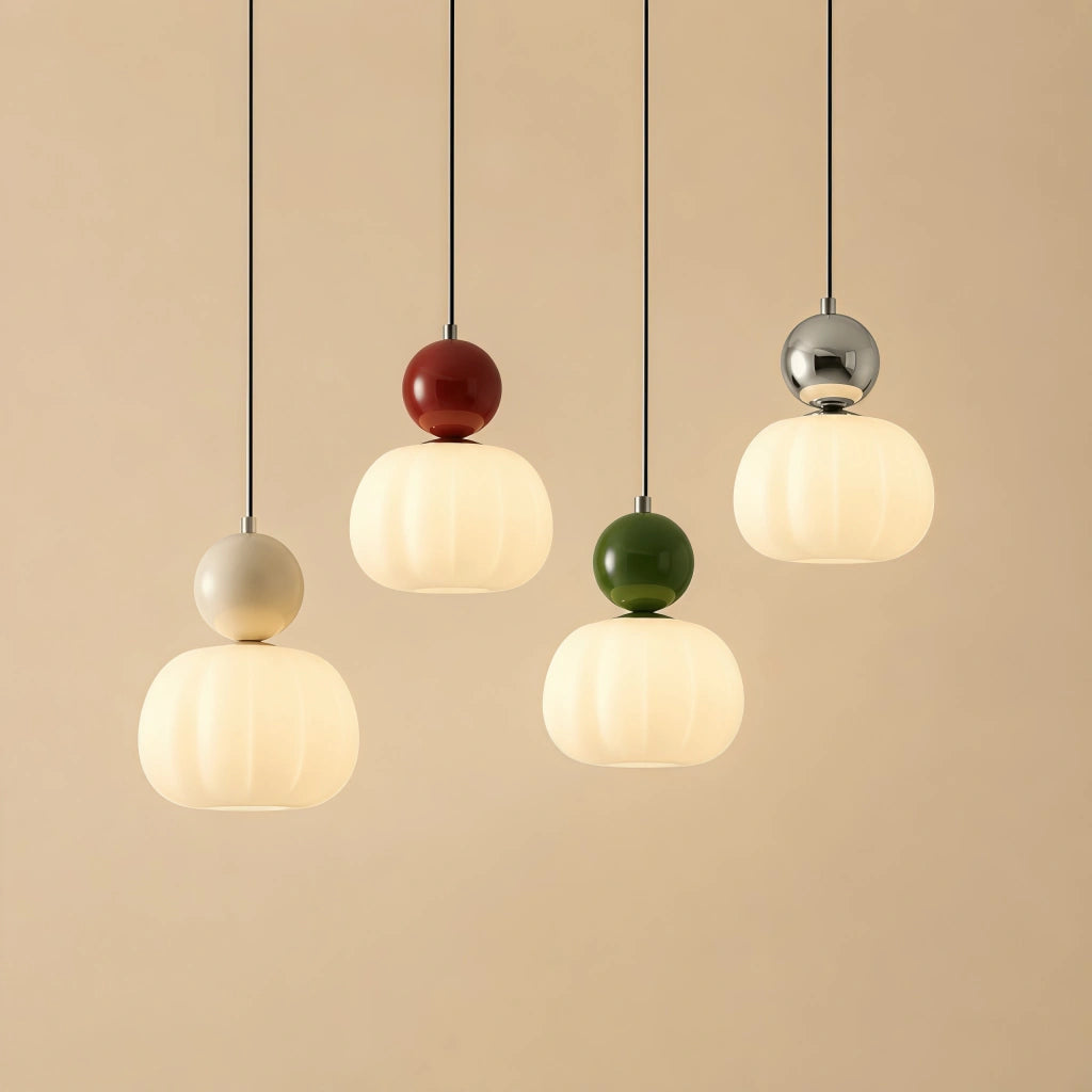 Cluster of multicolour debz Bauhaus pendant lights featuring red, green, silver, and beige accents