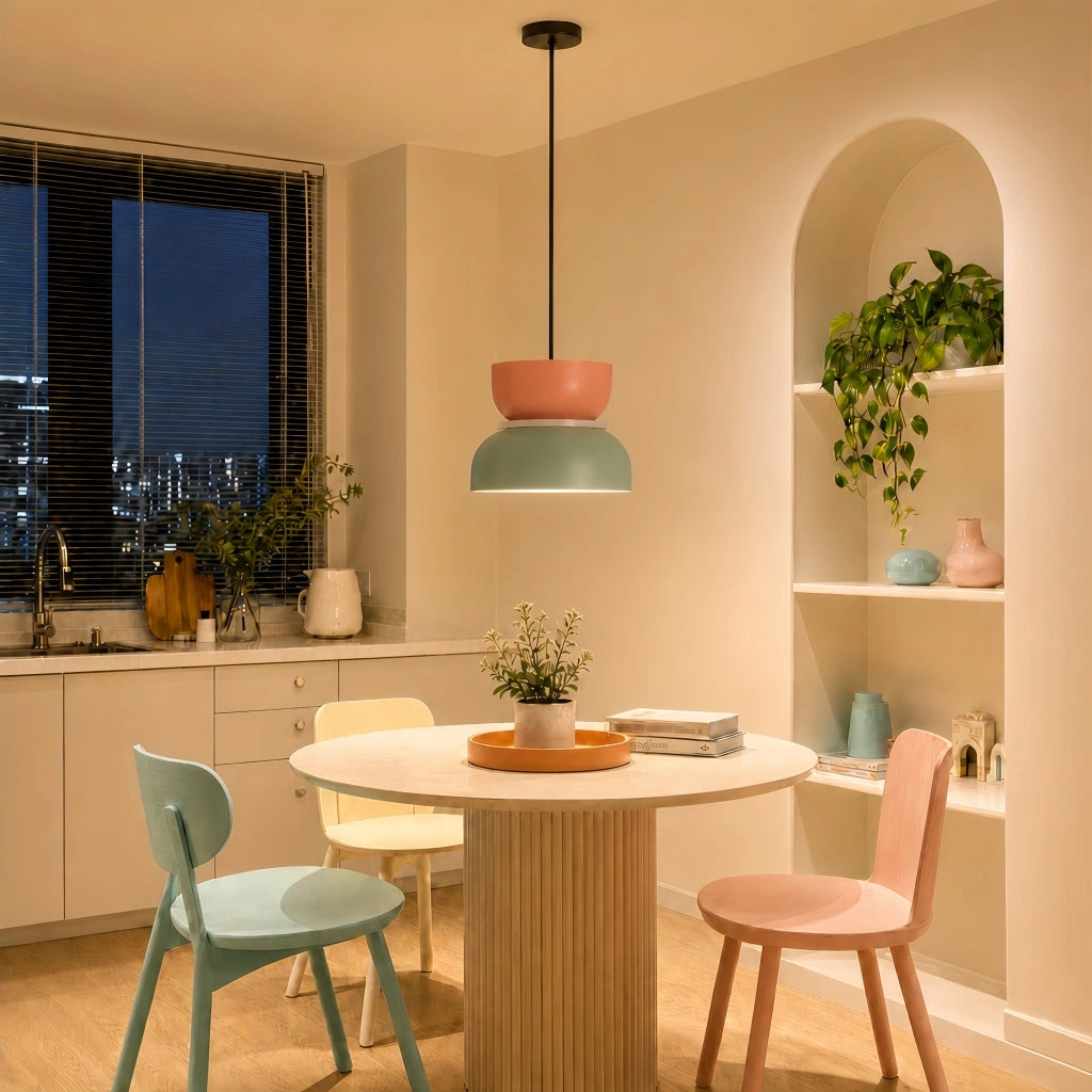 Pink and light green Nordic derq pendant providing soft ambient lighting in a contemporary kitchen and dining space