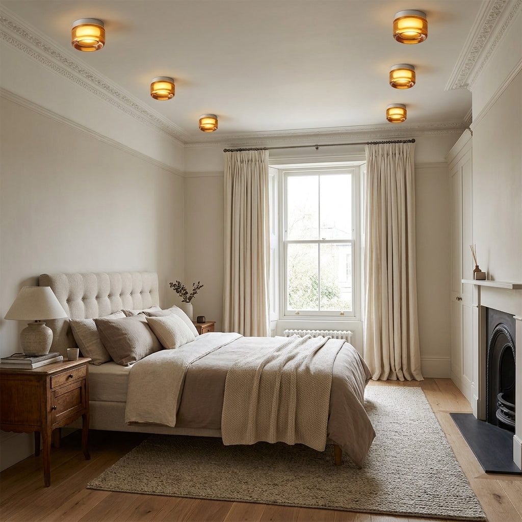 Doxlu round lights fitted in a bedroom ceiling, illuminated