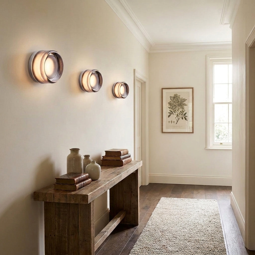 Doxlu wall sconces mounted along a hallway wall, illuminated
