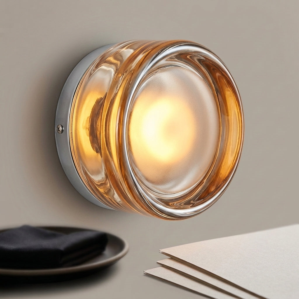 Doxlu amber glass wall sconce, angled studio view, illuminated