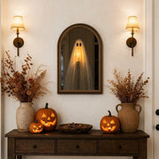 Ebonly glowing ghost mirror lit up above a Halloween entryway console table with jack-o'-lanterns