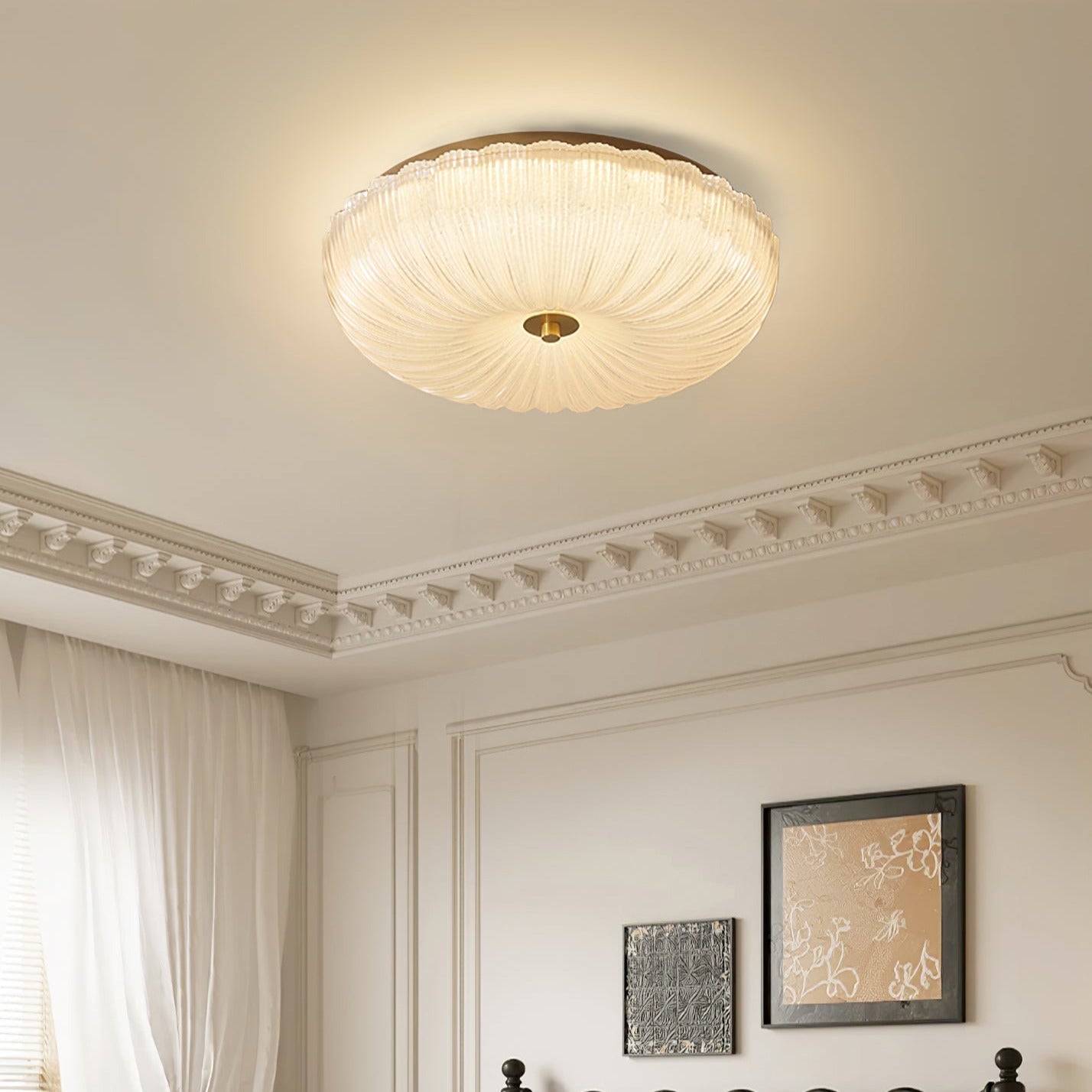 Elegant fluted glass flush mount installed on a ceiling with decorative crown moulding