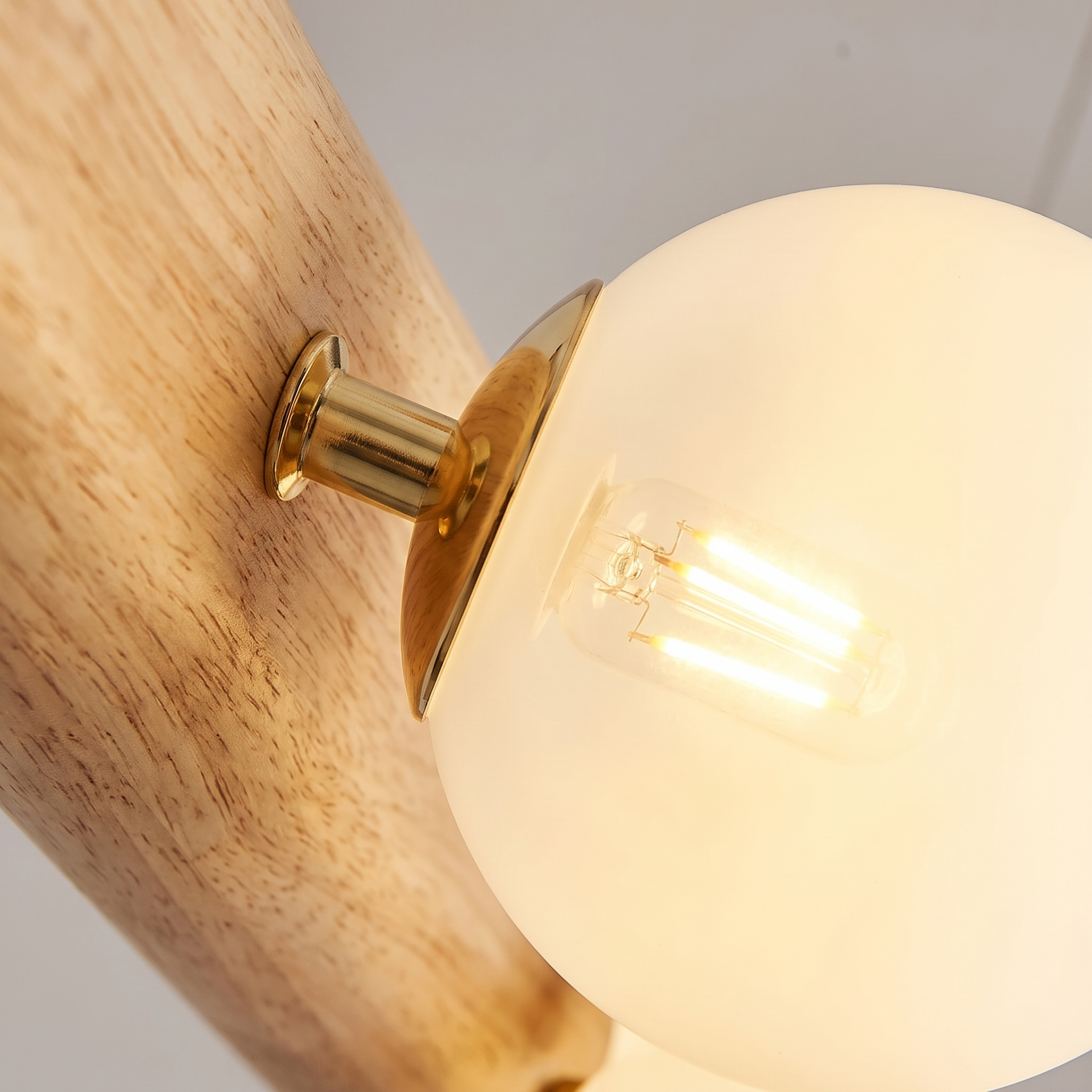 Close-up of a Fivqo glass globe with a warm glowing G9 LED bulb