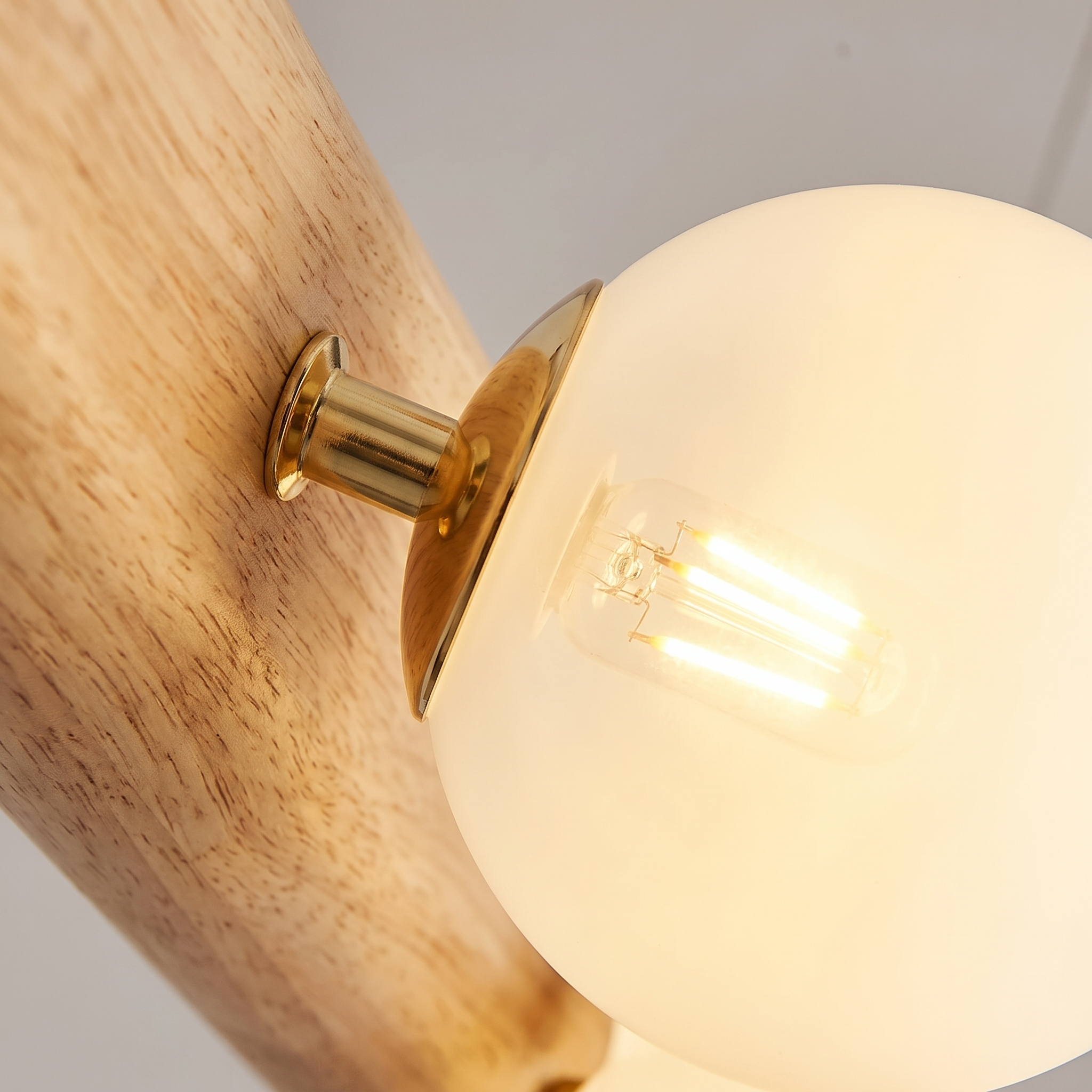 Close-up of a Fivqo glass globe with a warm glowing G9 LED bulb
