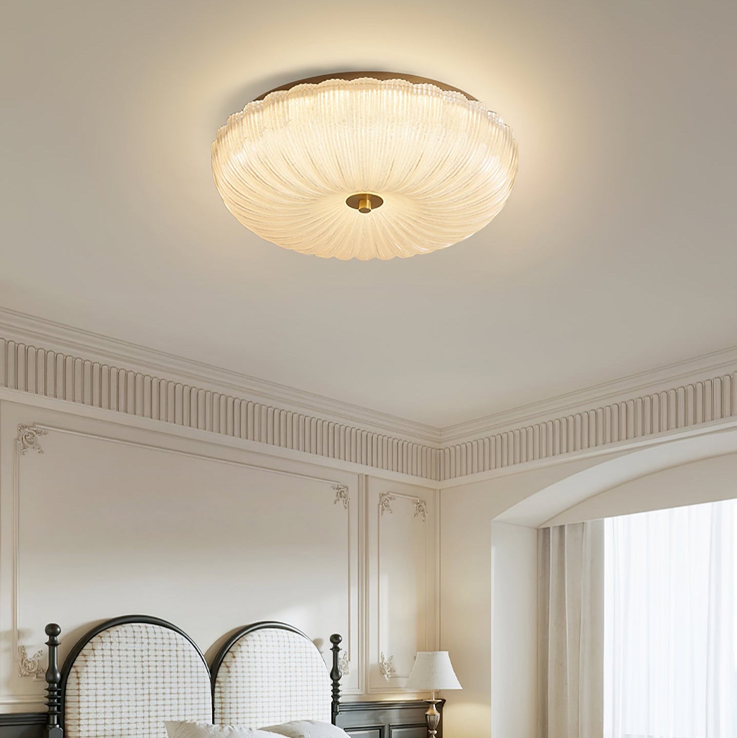 Fluted glass halo lamp installed in a bedroom with classic wall panelling