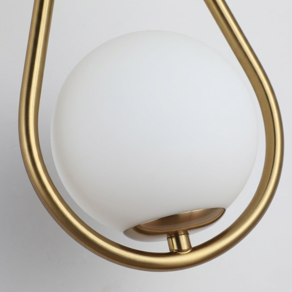 Folzi orb wall light, gold wall sconce, close-up, front view
