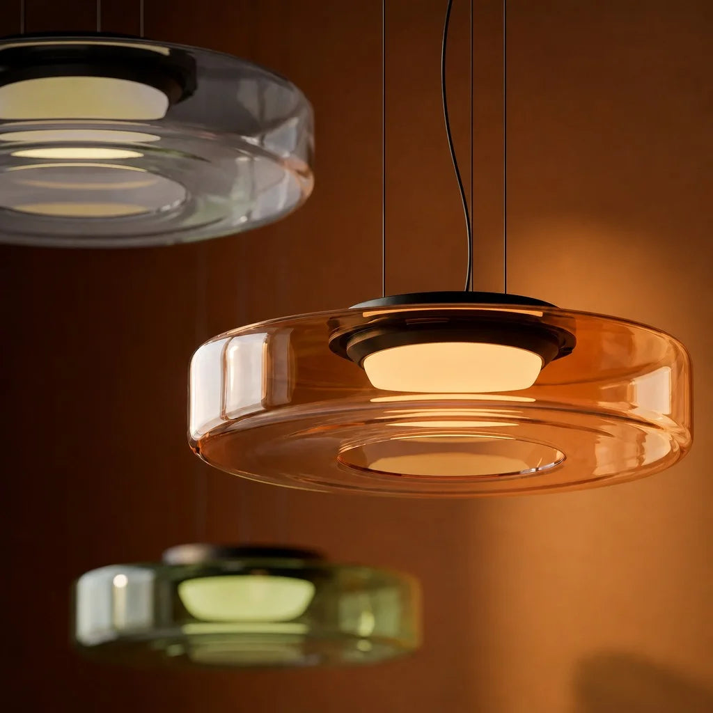 Close-up of an illuminated layered fujs glass pendant casting a warm, glare-free glow