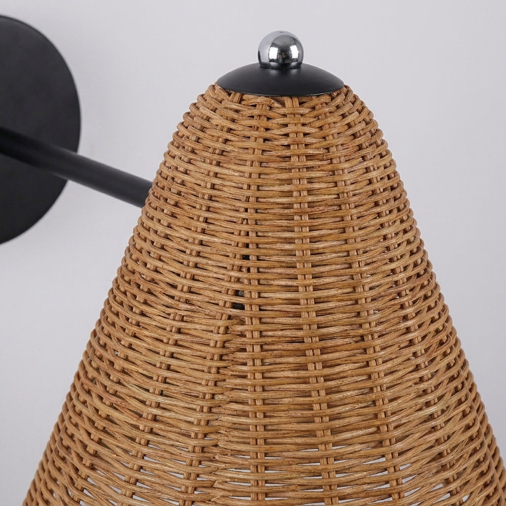 Close-up of Fumzi's hand-woven rattan shade texture and black iron fittings