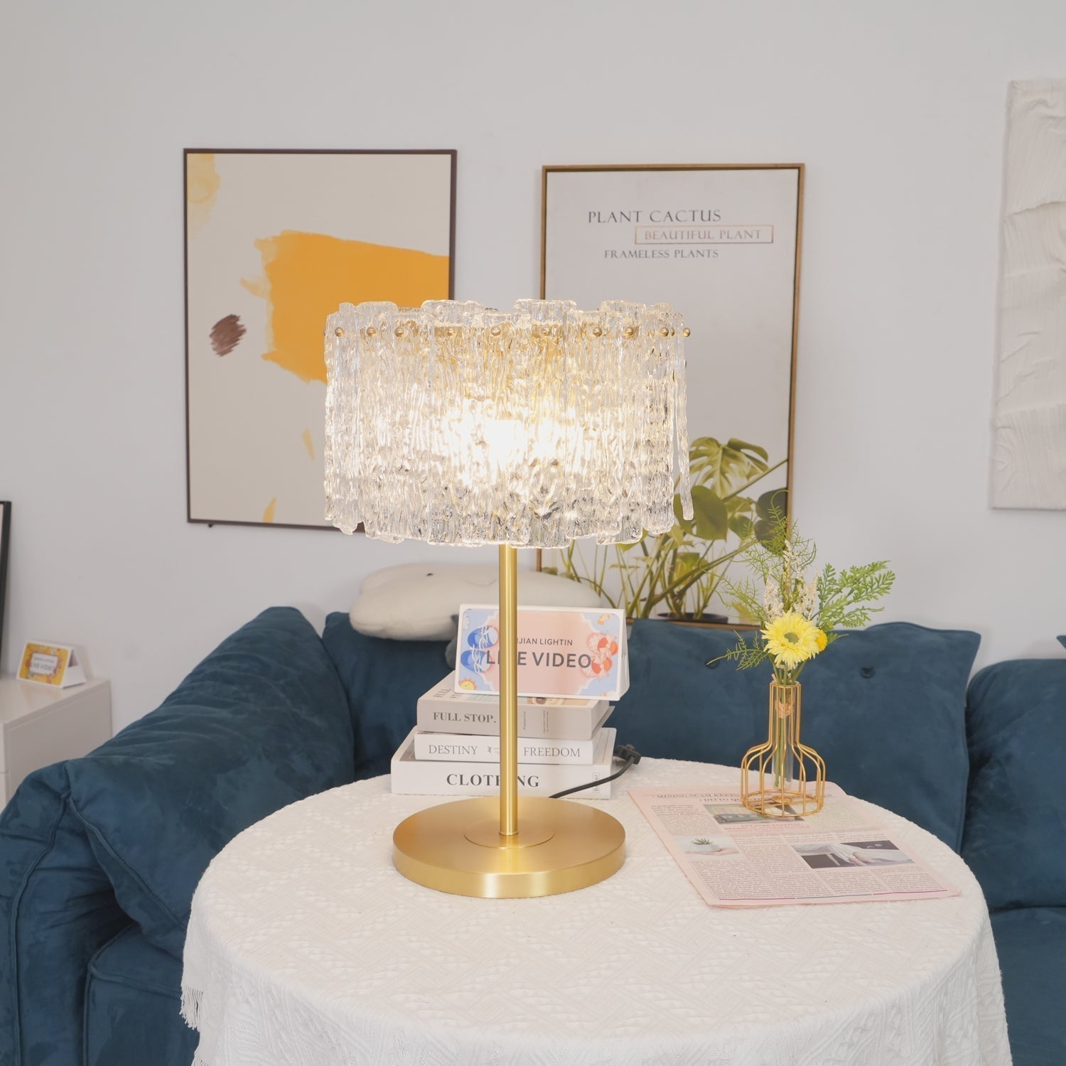 Art Deco brass fyns bedside lamp casting a warm ambient glow in a contemporary living space
