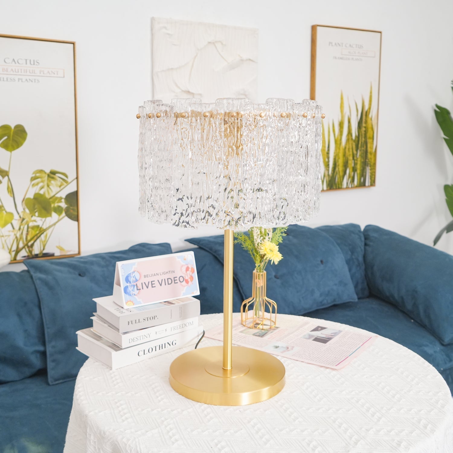 Elegant Art Deco glass fyns console lamp acting as a luxurious centrepiece in a blue-accented living room