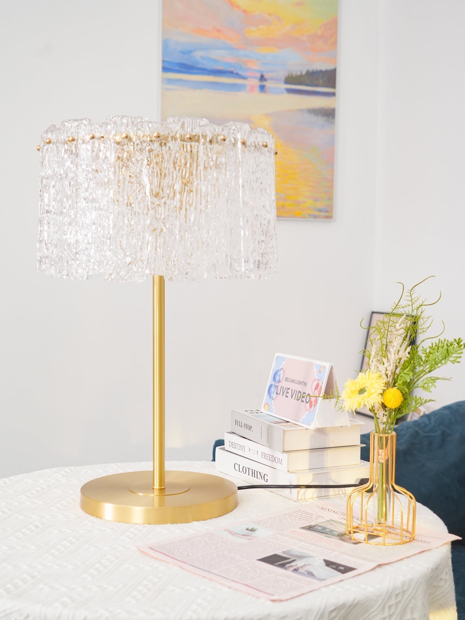 Vintage-inspired brass and glass fyns side table lighting casting beautiful refractions across a living room