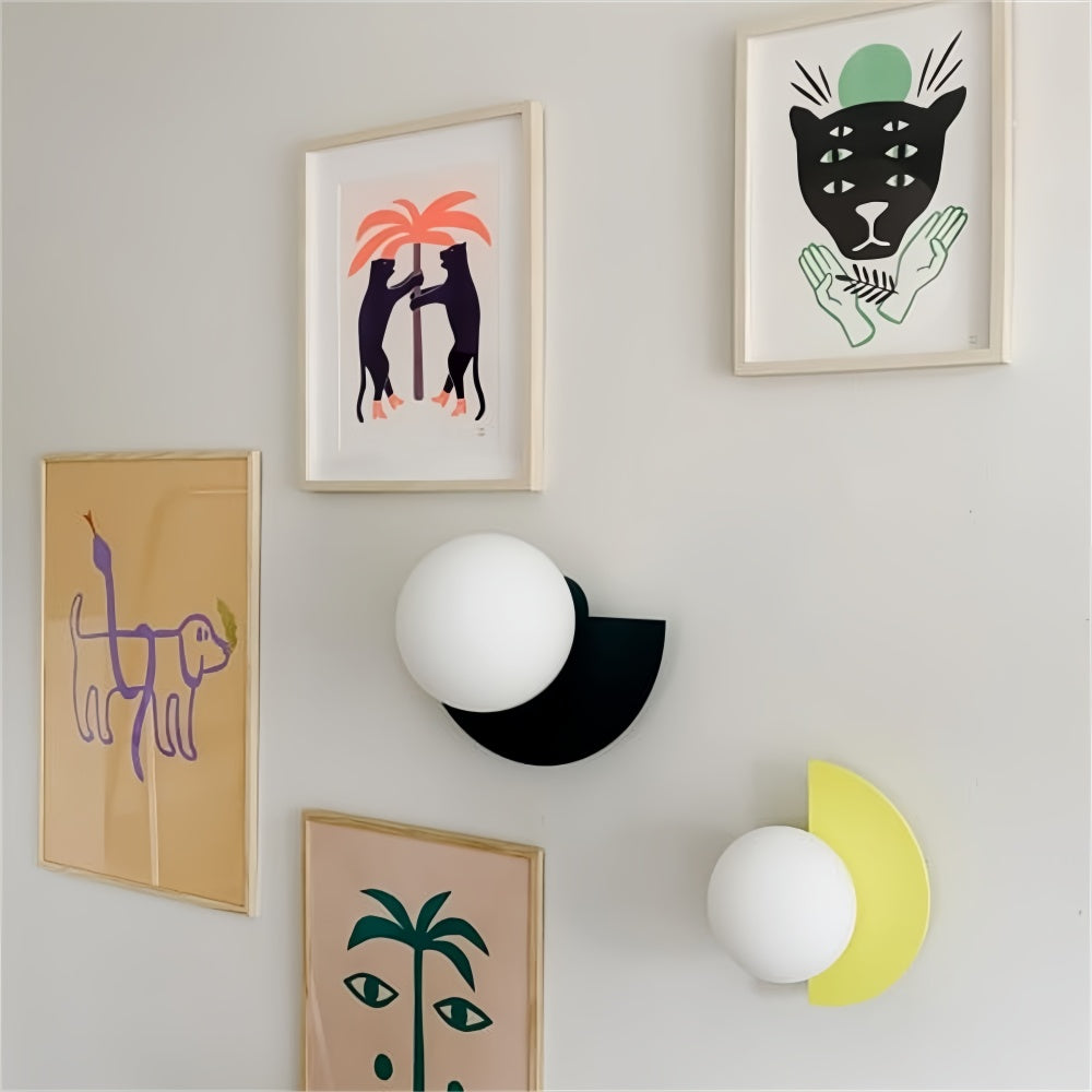 White, black, and yellow geometric accent lights integrated seamlessly into a modern art gallery wall