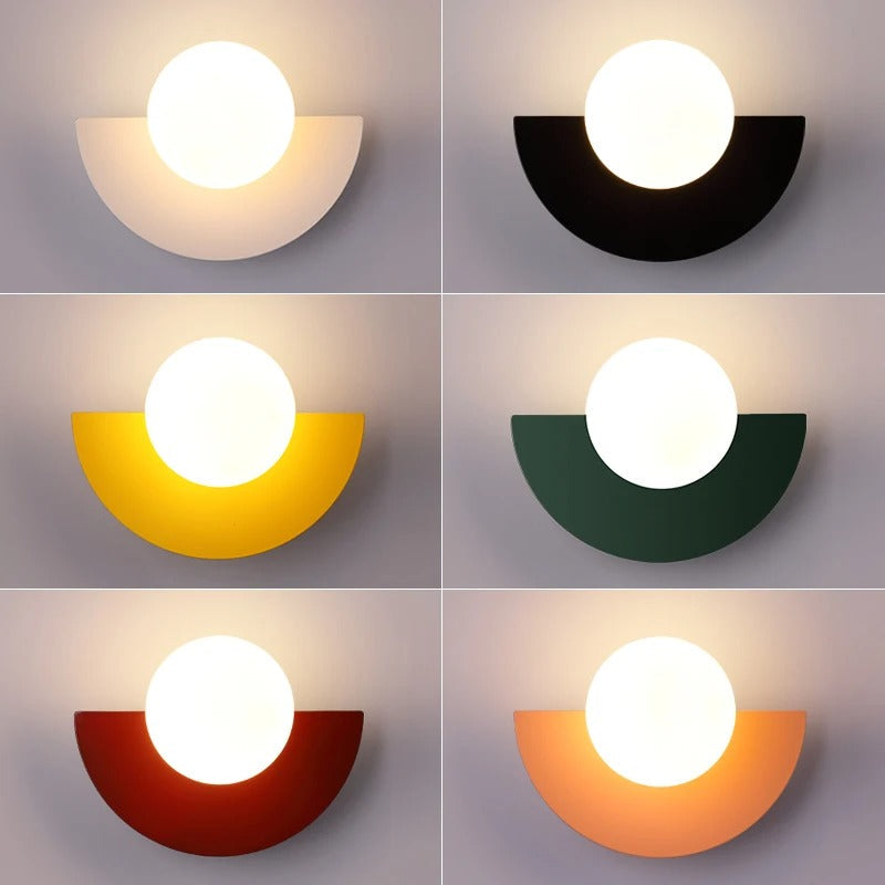 Colour variants for the geometric globe sconce, showcasing white, black, yellow, green, red, and orange finishes