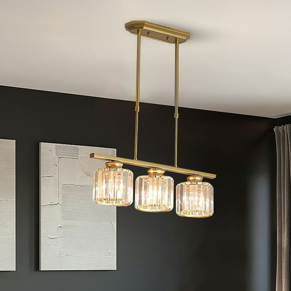 Gold 3-light round ribbed glass pendant casting a warm glow over a dark sideboard