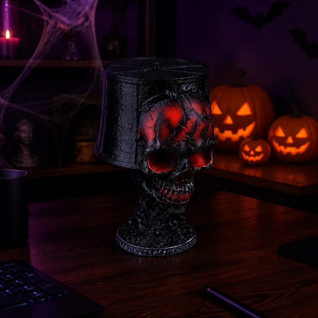 Gorren gothic skull lava lamp on a dark desk in a gothic room at night with pumpkins, cobwebs and bats for a Halloween scene