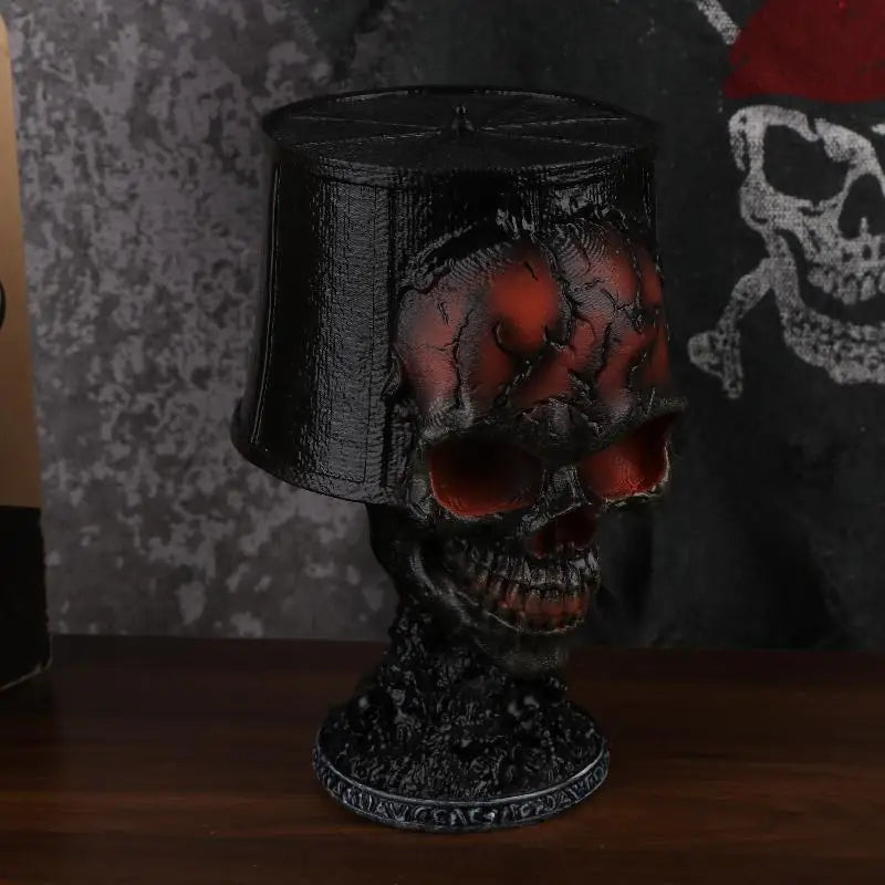 Gorren gothic skull lava lamp lit up on a wooden shelf, angled view