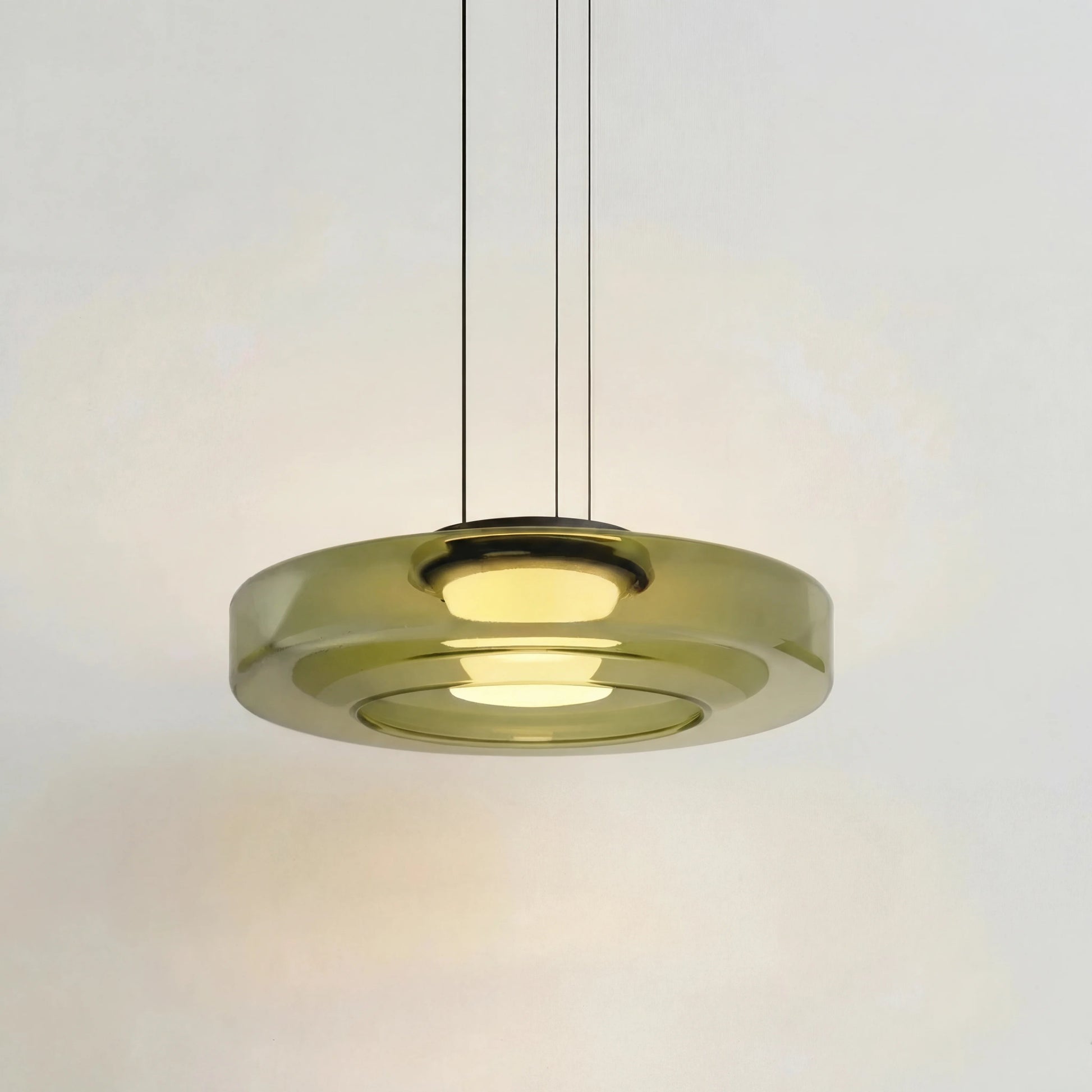 Green 1-layer mid-century glass ceiling lamp showcasing its translucent tinted shades