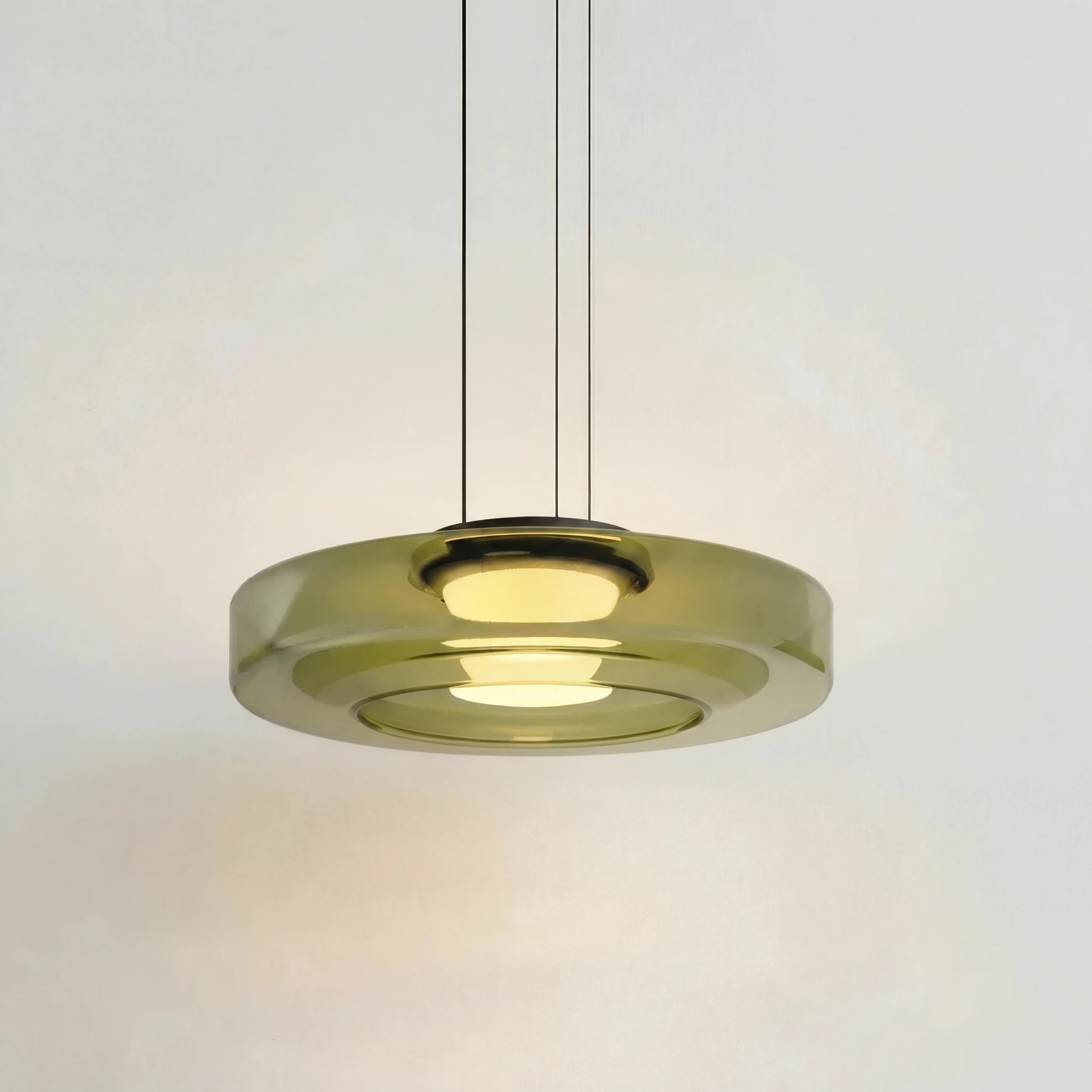 Green 1-layer mid-century glass ceiling lamp showcasing its translucent tinted shades