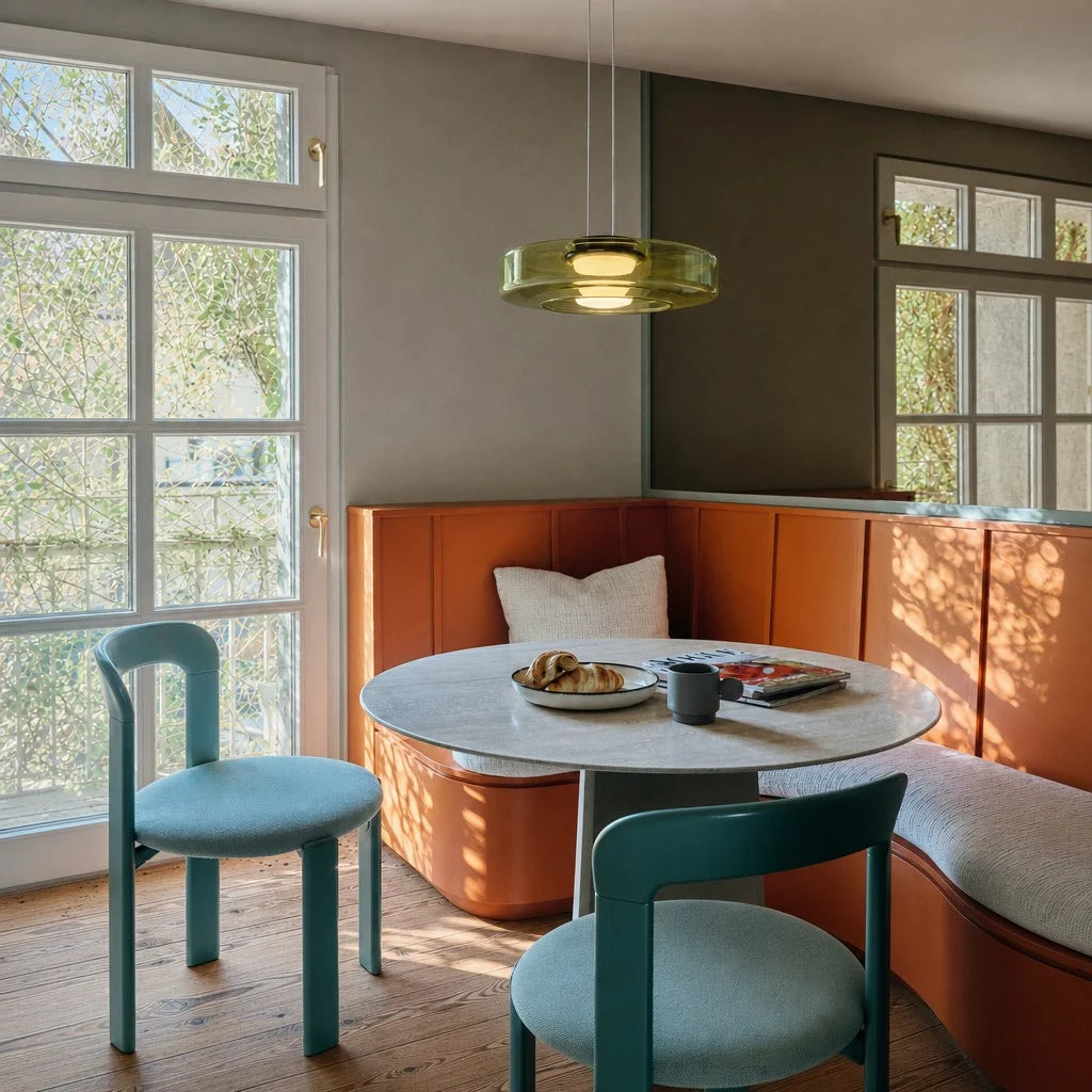 Green 1-layer Nordic glass pendant light illuminating a cosy modern dining nook