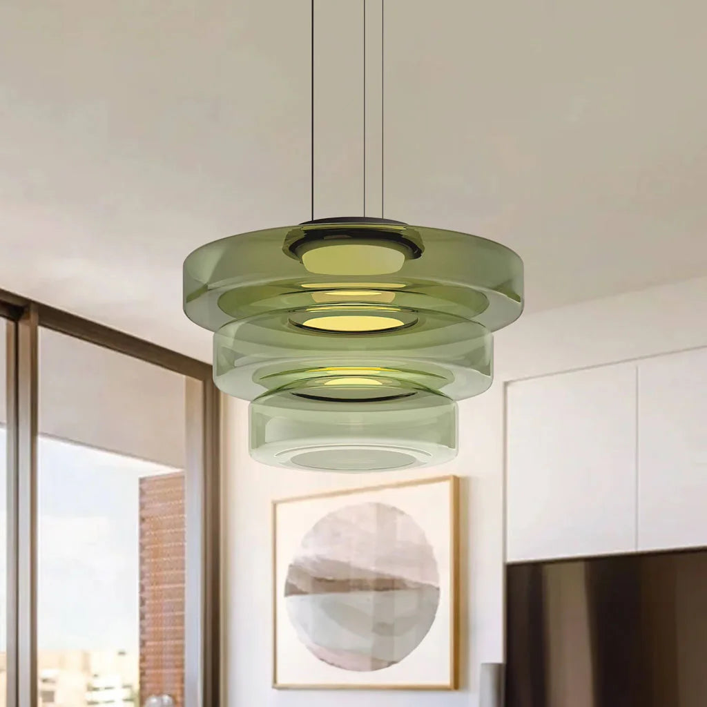Green 3-layer Bauhaus glass pendant light hanging against a neutral living room background