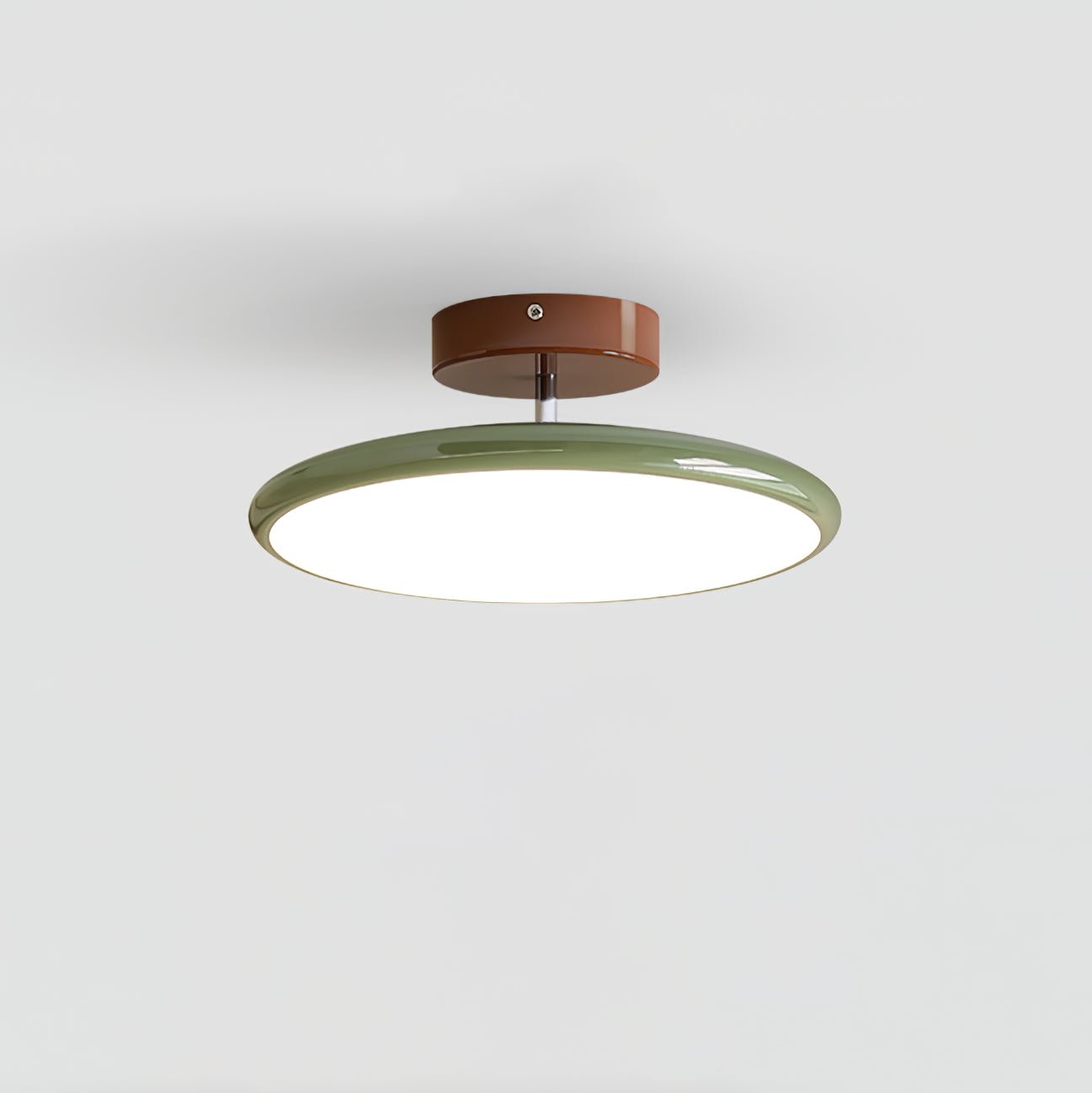 Green variant of the modern adjustable LED flush mount ceiling light isolated on a grey background