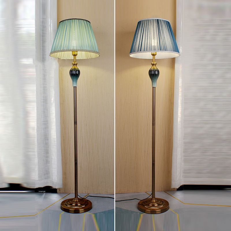 Side-by-side comparison of the green and blue pleated fabric floor lamps