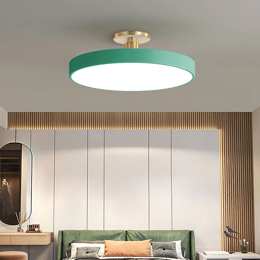 Green drum LED ceiling light contrasting beautifully in a bedroom with wooden slatted walls