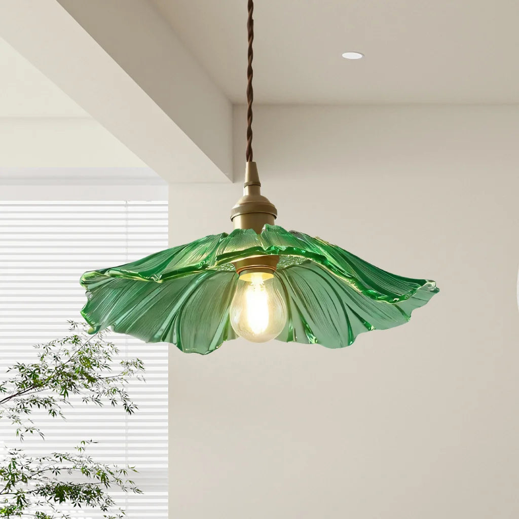 Green floral glass pendant light showcasing its wavy, hand-blown shade