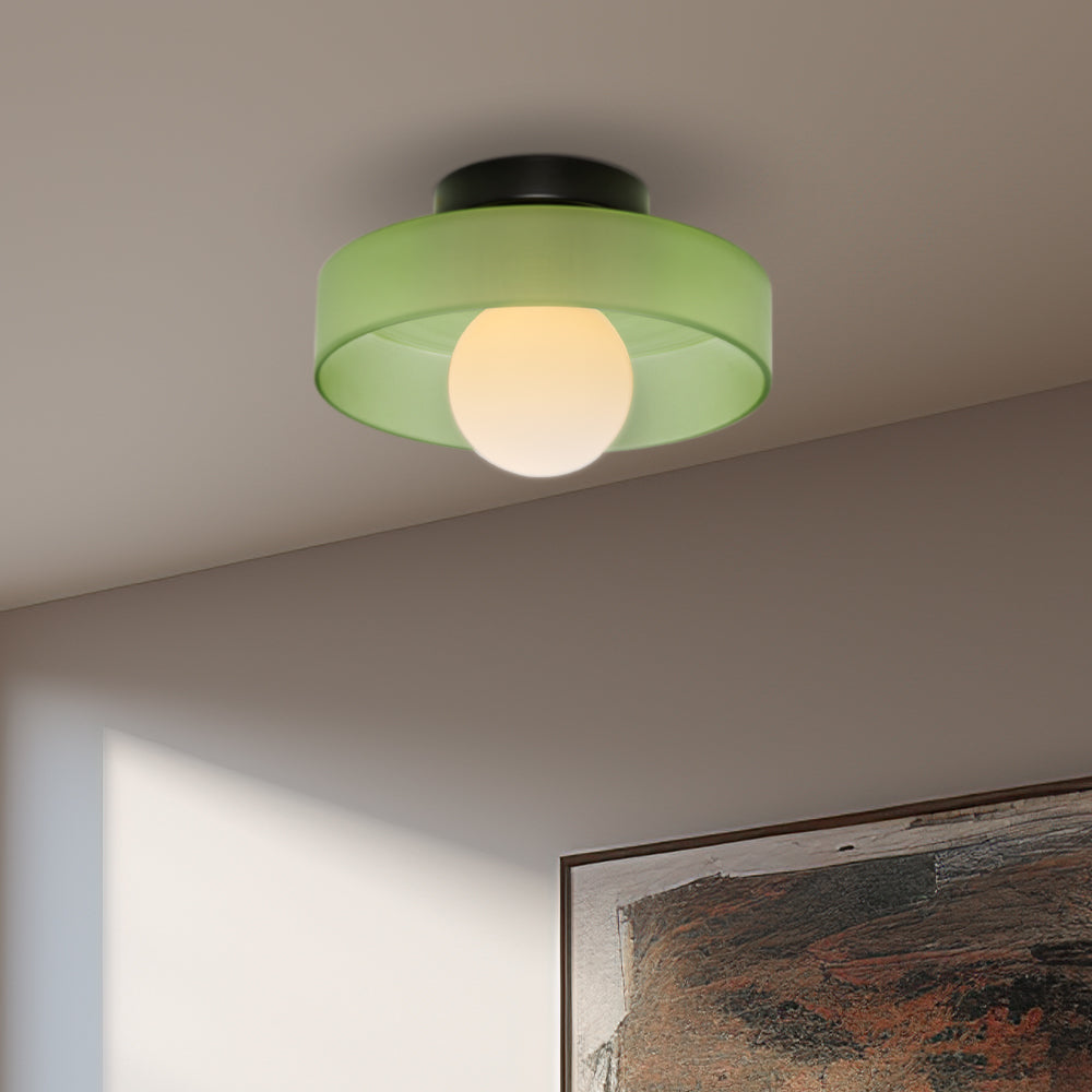 Green frosted glass semi-flush mount ceiling light casting a soft, glare-free glow