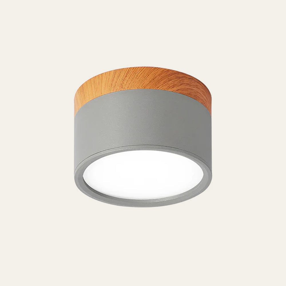 Matte grey aluminium cylinder surface spotlight with warm wood-effect detail