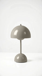 Modern grey cordless mushroom table lamp showcasing its sleek, minimalist dome silhouette