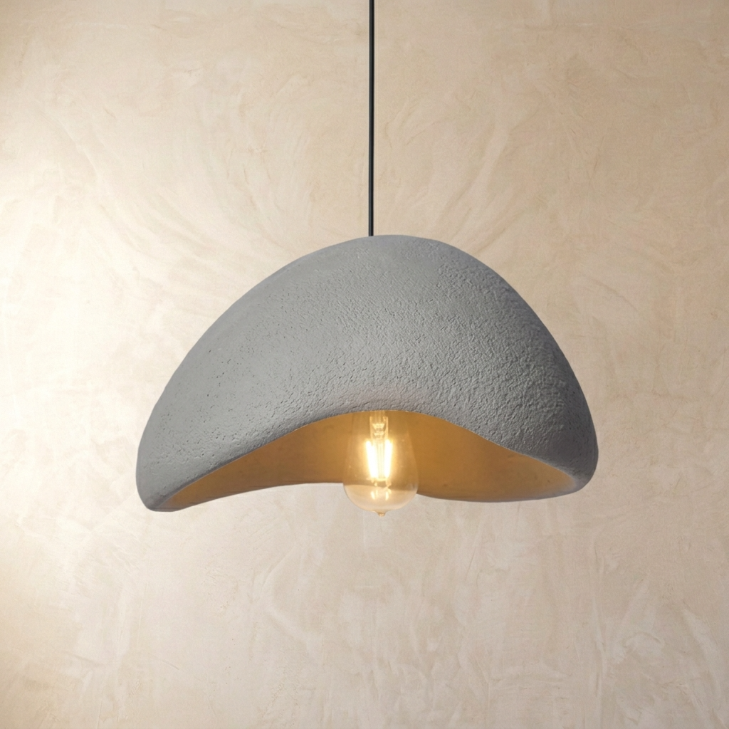 grey Japandi style resin pendant showing the internal warm light bulb