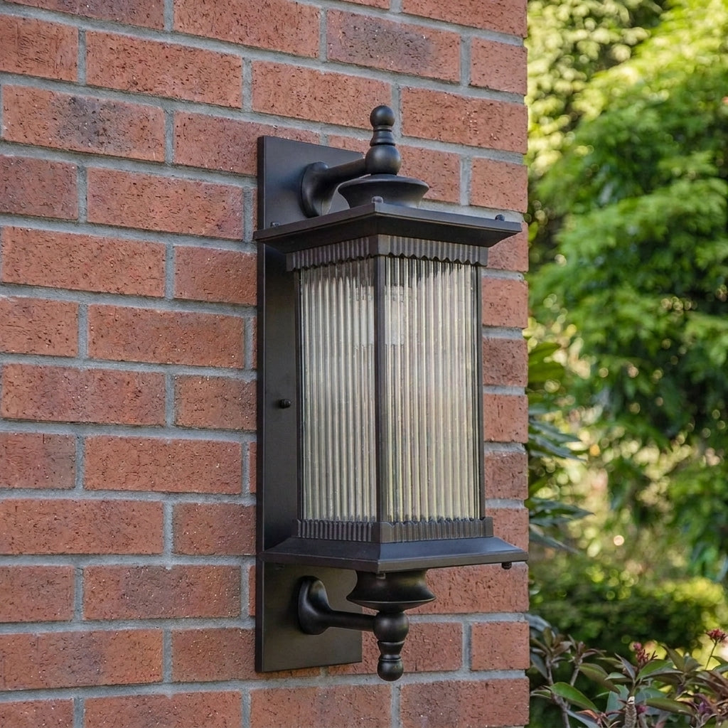Gumzi exterior lantern wall light on a brick wall lifestyle shot