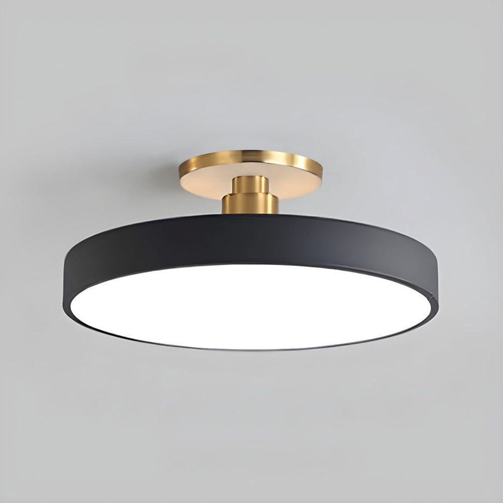 Isolated view of the modern black minimalist drum guoj ceiling lamp with a gold canopy