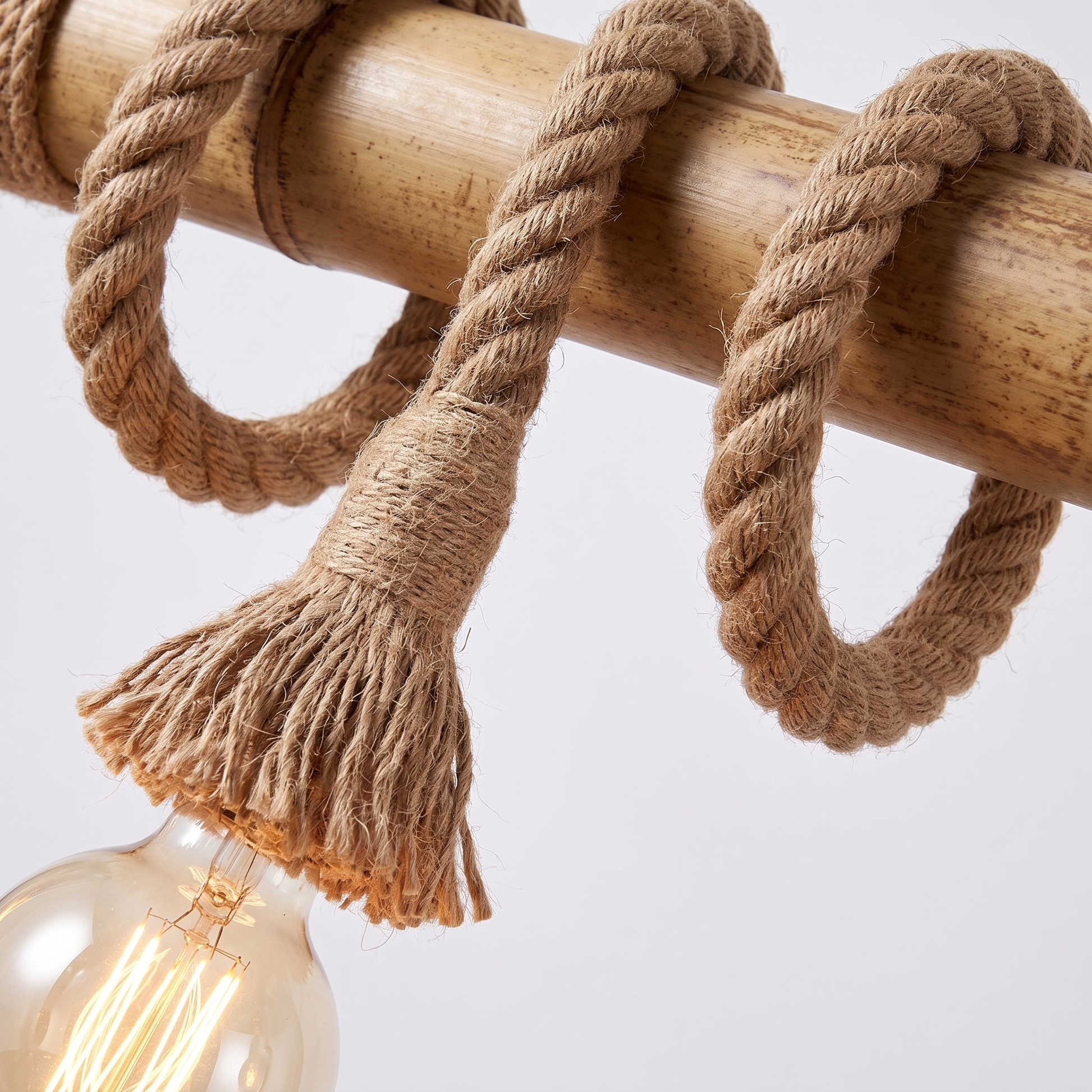 Hukni chandelier detail, hand-coiled rope-tasselled socket with exposed bulb