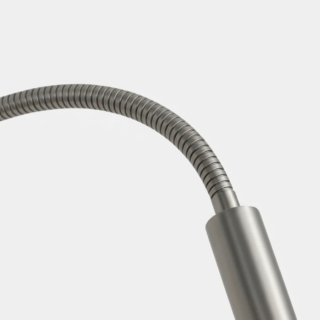 Close-up of the Hulzi nickel wall light's flexible gooseneck arm