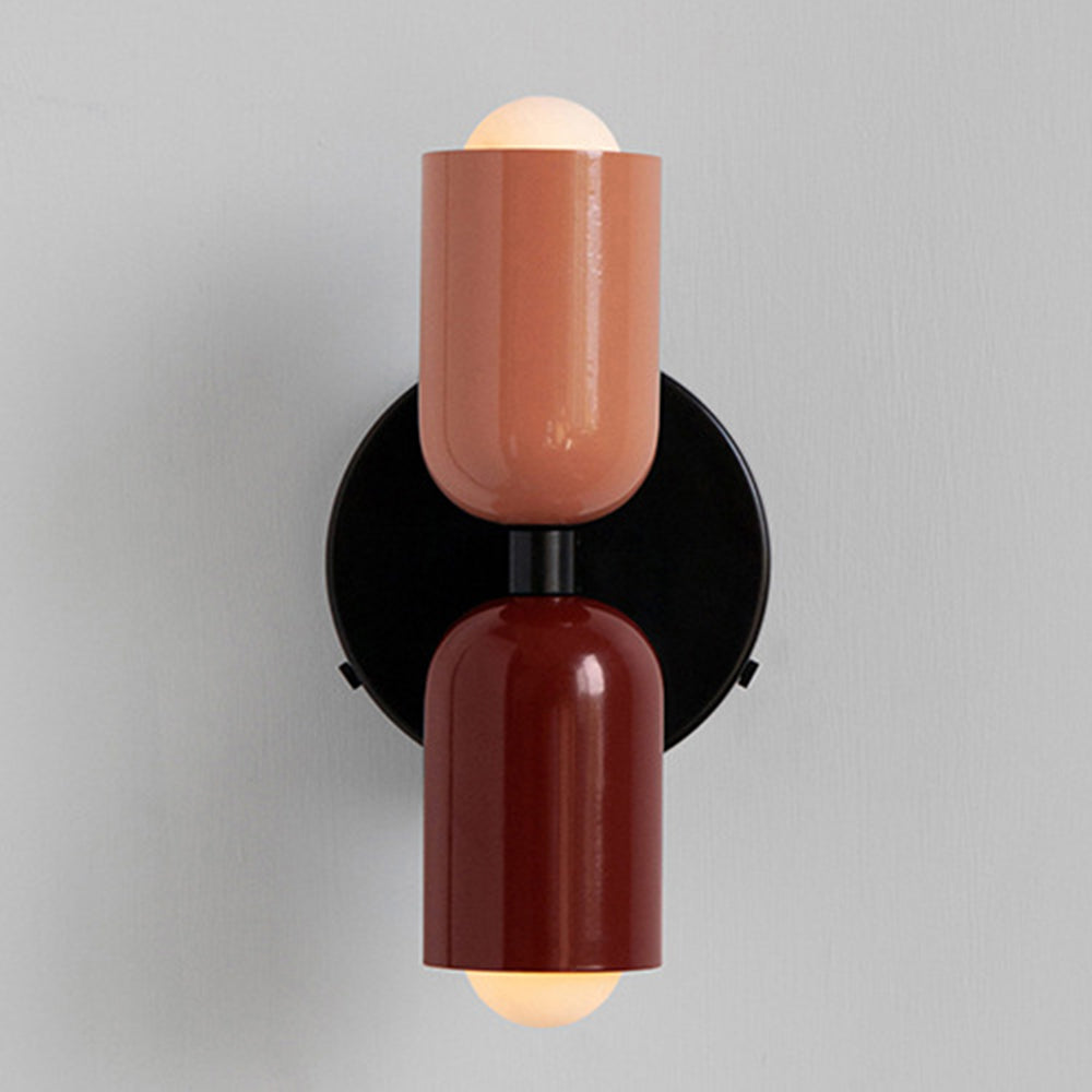 Pink and red hutre two-tone glass wall lamp with a retro pill-shaped design