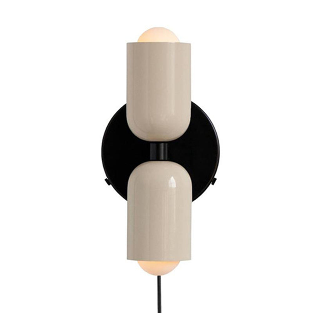 Solid hutre white glass capsule wall light providing a clean, minimalist aesthetic