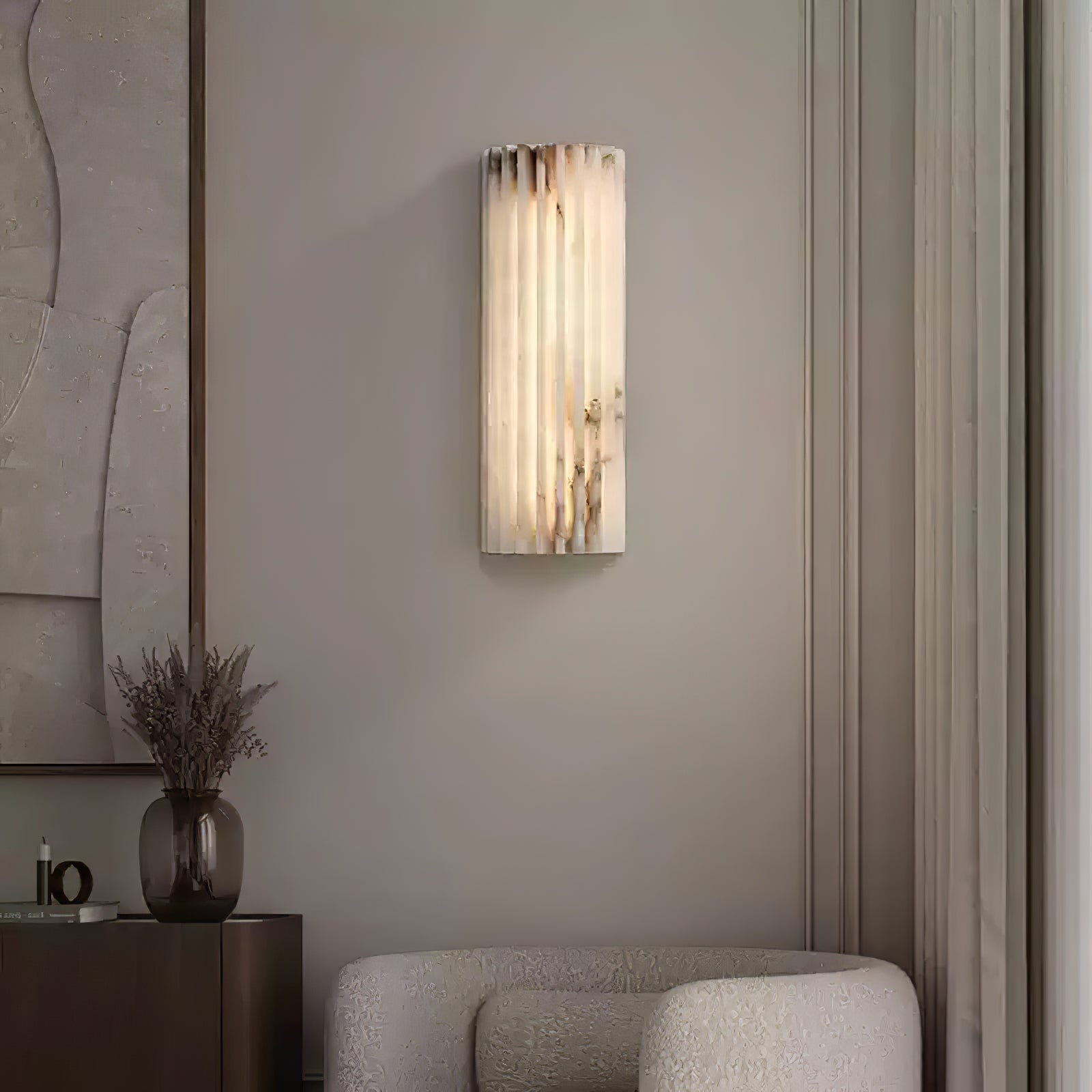 Illuminated alabaster wall sconce adding a luxurious touch to a cosy living room corner
