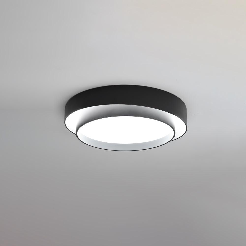 Illuminated black concentric halo ceiling light demonstrating its uniform, glare-free light diffusion