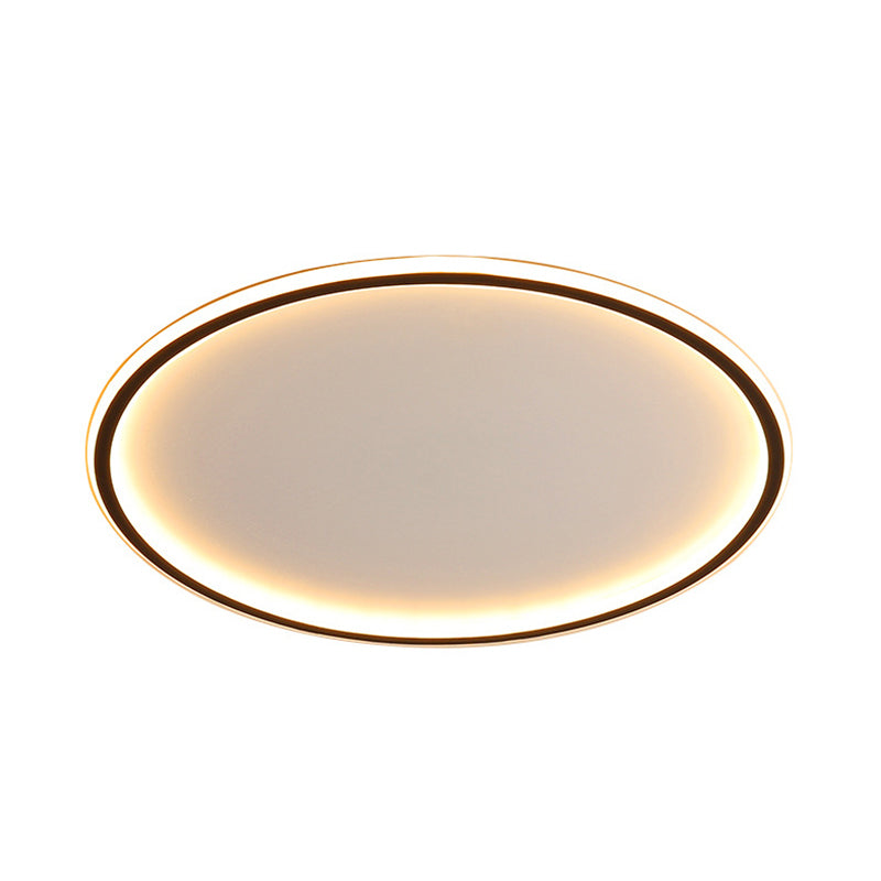 Front view of the illuminated black halo ring flush mount ceiling light showing its thin 5cm profile