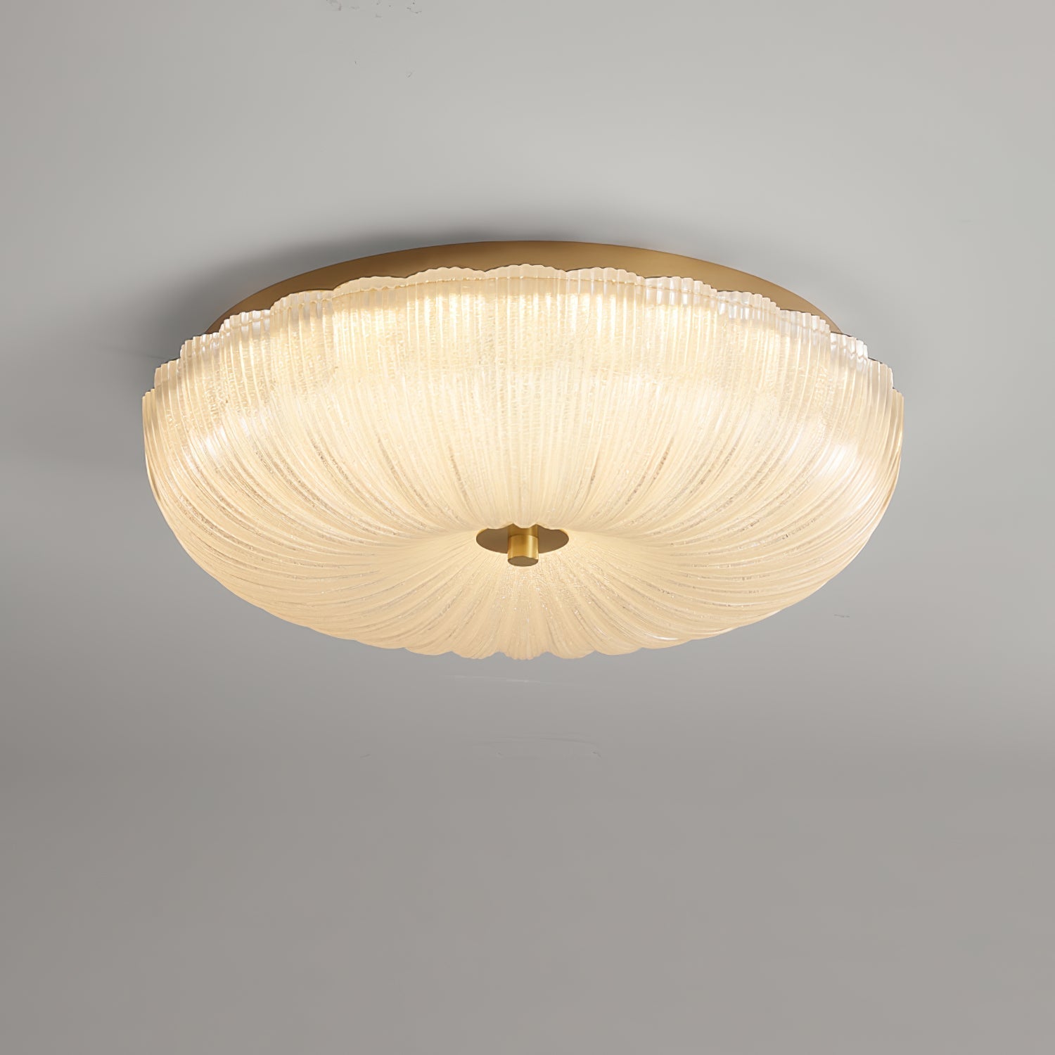 Illuminated ripple glass halo ceiling light showcasing its textured prismatic shade
