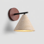 Imzo travertine stone cone wall sconce with black metal arm and wood backplate, angled hero view, lit