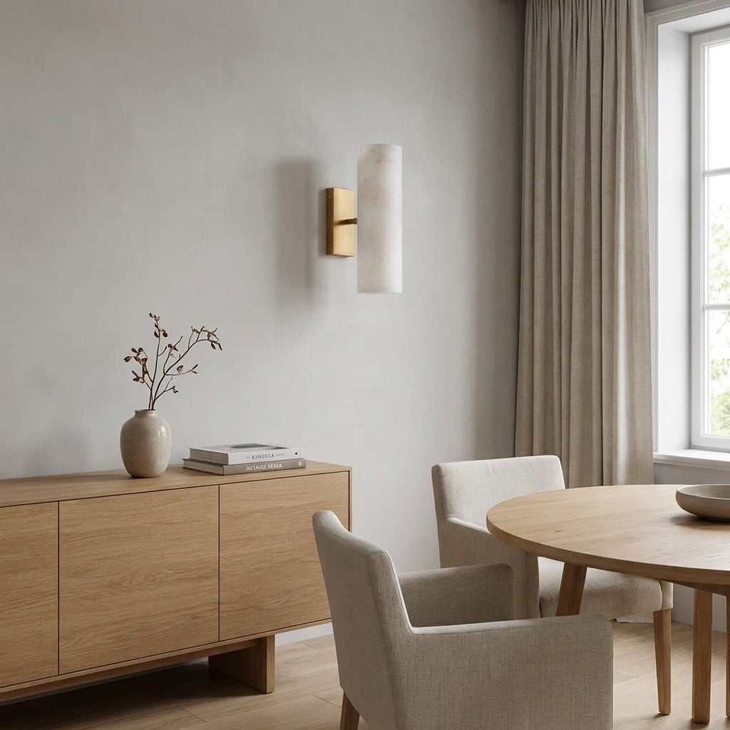 Ivzo brass alabaster wall sconce above a dining room sideboard