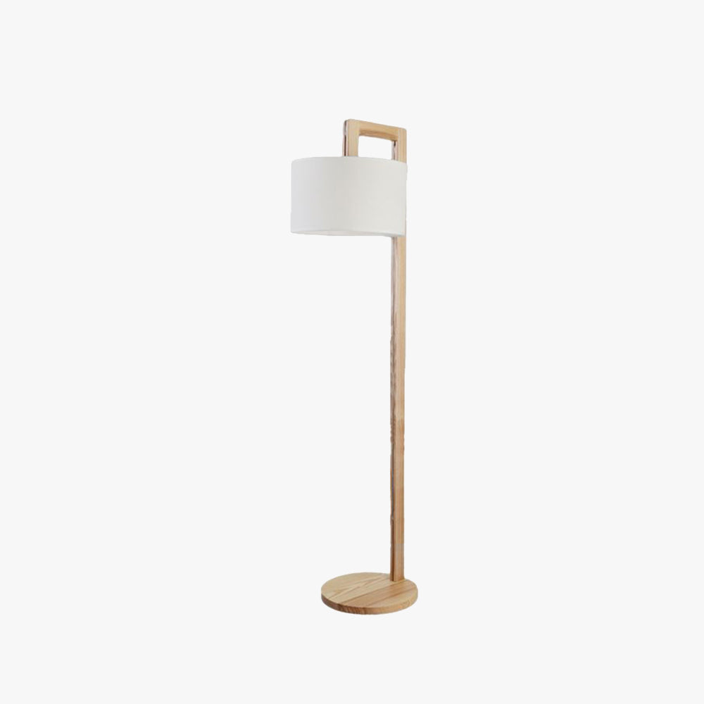 Japandi style solid wood floor lamp with overhanging fabric shade isolated on a white background