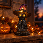 Jinx witch hat cat lamp glowing on a rustic mantelpiece with a carved pumpkin at dusk