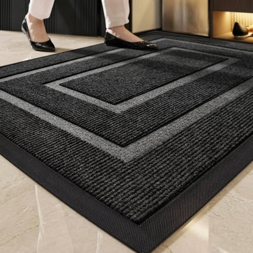 Close-up of the Kalzu black outdoor doormat's border pattern and texture