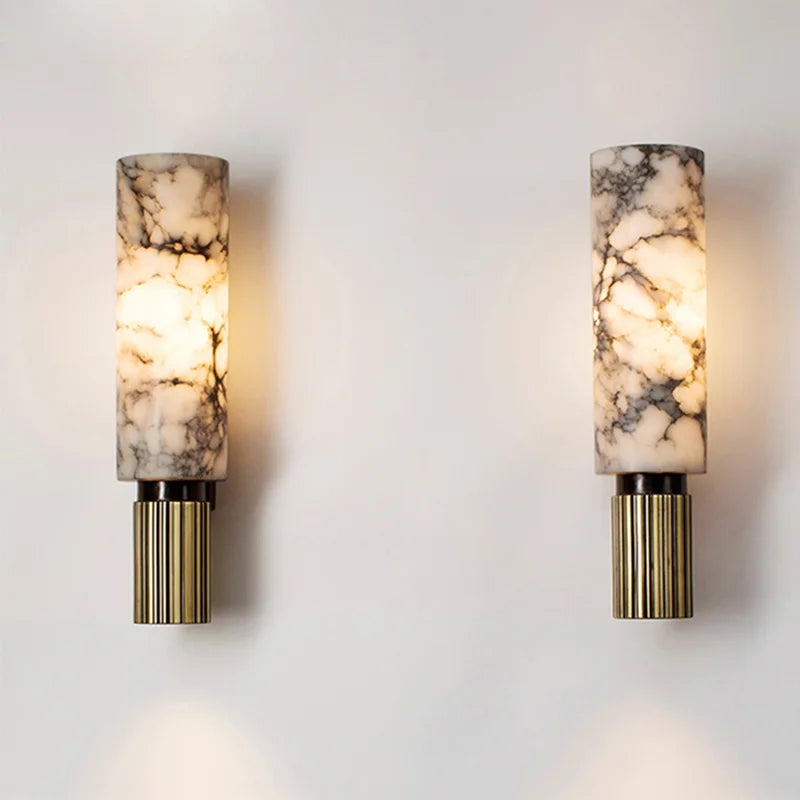 Two glowing natural marble kopu wall lights mounted symmetrically as elegant bedside or hallway lighting